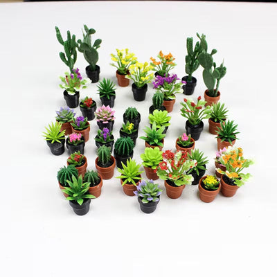 Collection of miniature potted succulents and cacti figurines